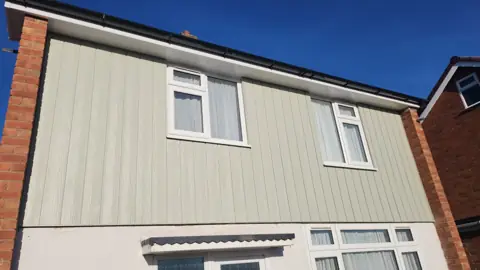 Vertical cladding above an entrance — CG Cladding Solutions