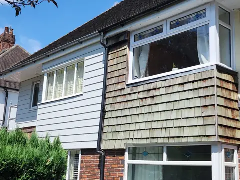 A house front during its transformation — CG Cladding Solutions