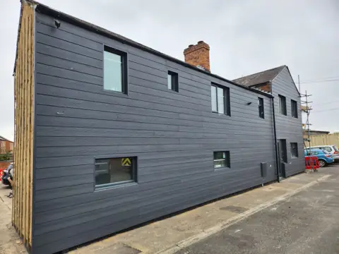 Long elevation with horizontal cladding — CG Cladding Solutions